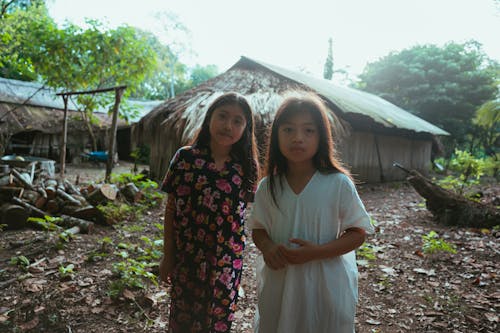 Photo Of Two Young Girls Standing Beside Each Other