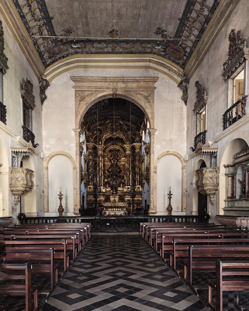 Brown Wooden Pews Inside the Church