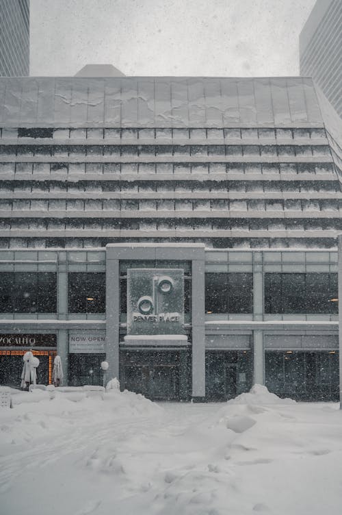 Snow Covered Street Near Business Establishment