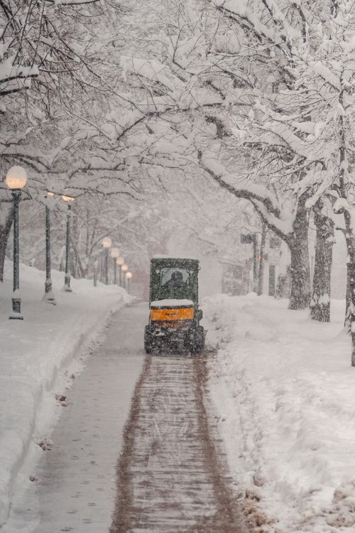 Free A snowplow on a Denver street clearing snow during a heavy winter storm. Stock Photo