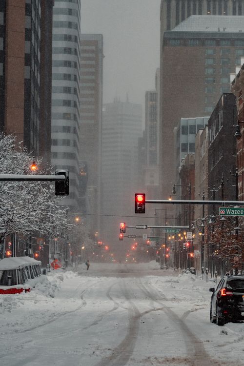 Free A cold, snowy day in downtown Denver with traffic lights and snow-covered streets. Stock Photo