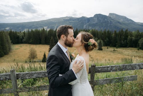 A Newlywed Couple Kissing 