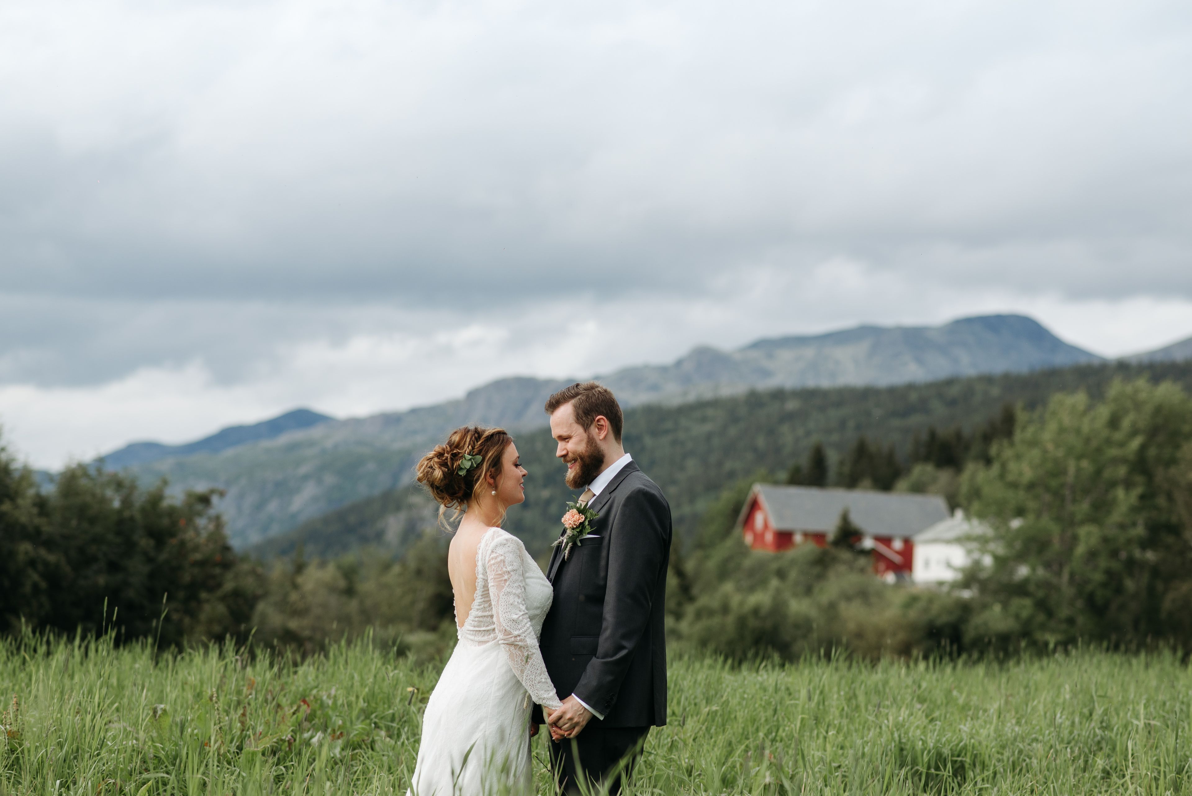 Bride and groom in an open meadow