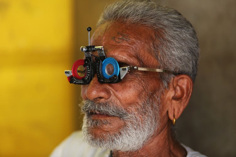 Elderly Man Wearing An Eye Trial Lens Frame