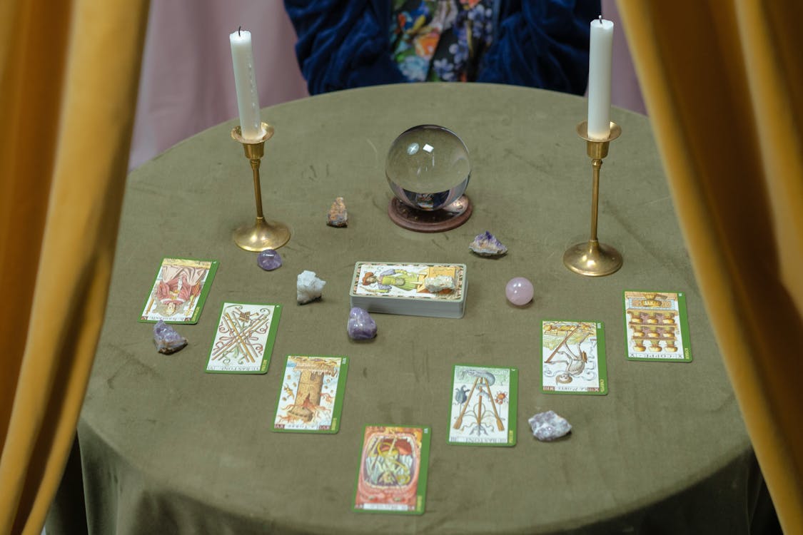 Free Tarot Cards and a Crystal Ball on the Table Stock Photo