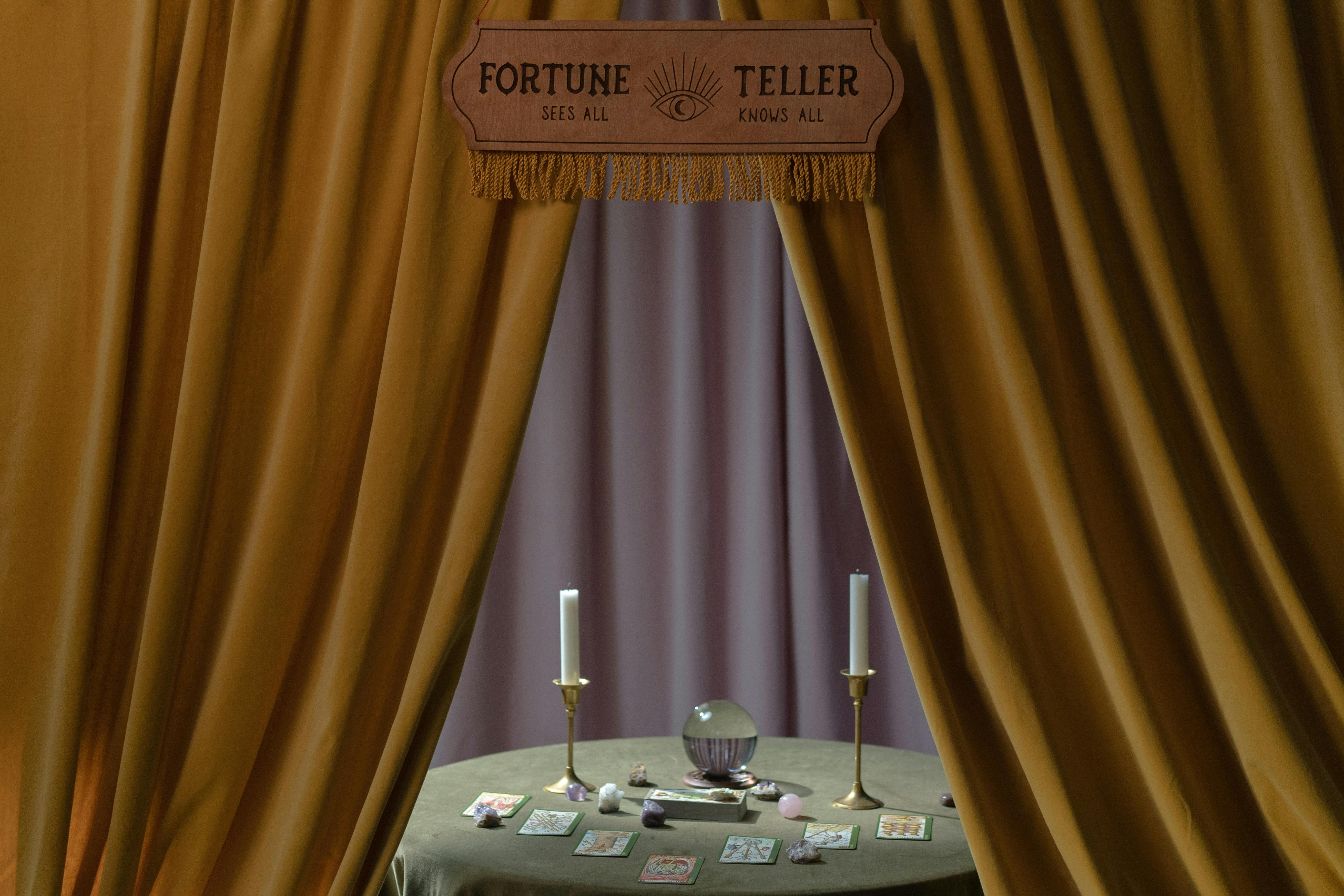 a fortune teller booth with a table full of fortune telling tools