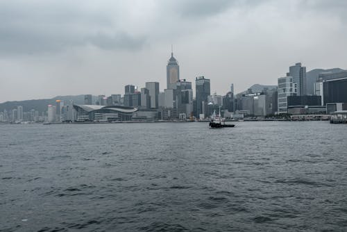 Free The Famous City Buildings at Victoria Harbour in Hong Kong from Across the River Stock Photo
