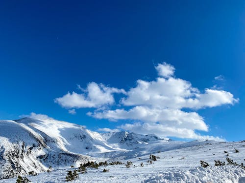 Snow Covered Mountain Under Blue Sky