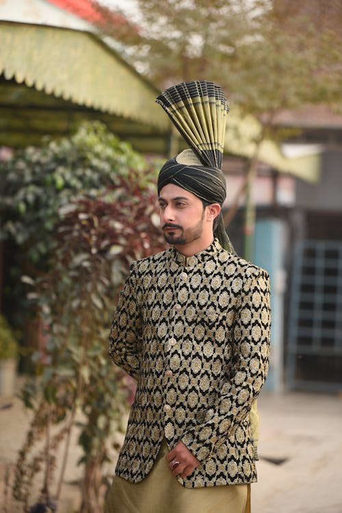 Free A Man in Traditional Wedding Outfit with a Striking Turban Stock Photo
