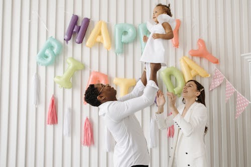 Free A Father Lifting His Daughter Stock Photo