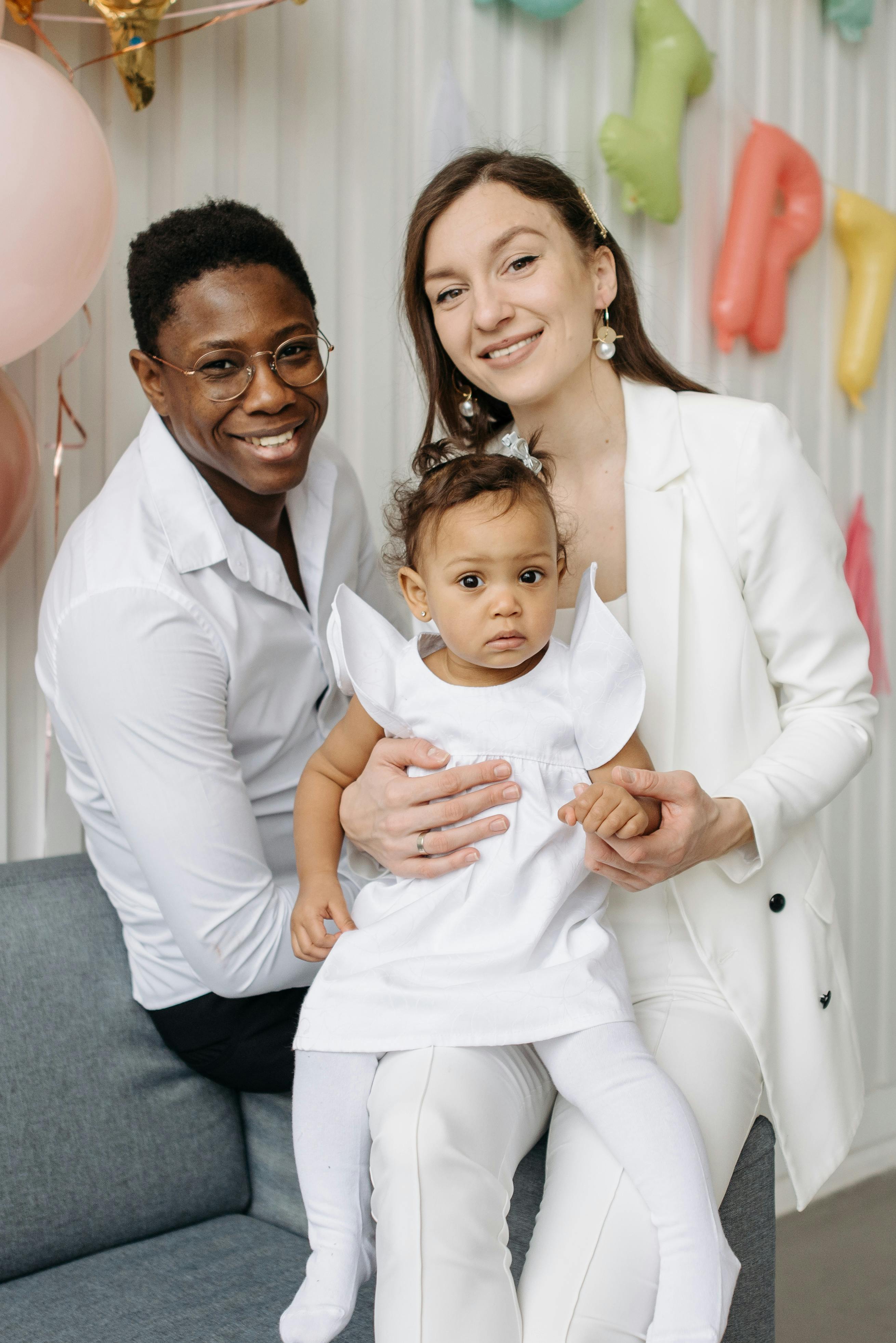 couple with their daughter sitting together