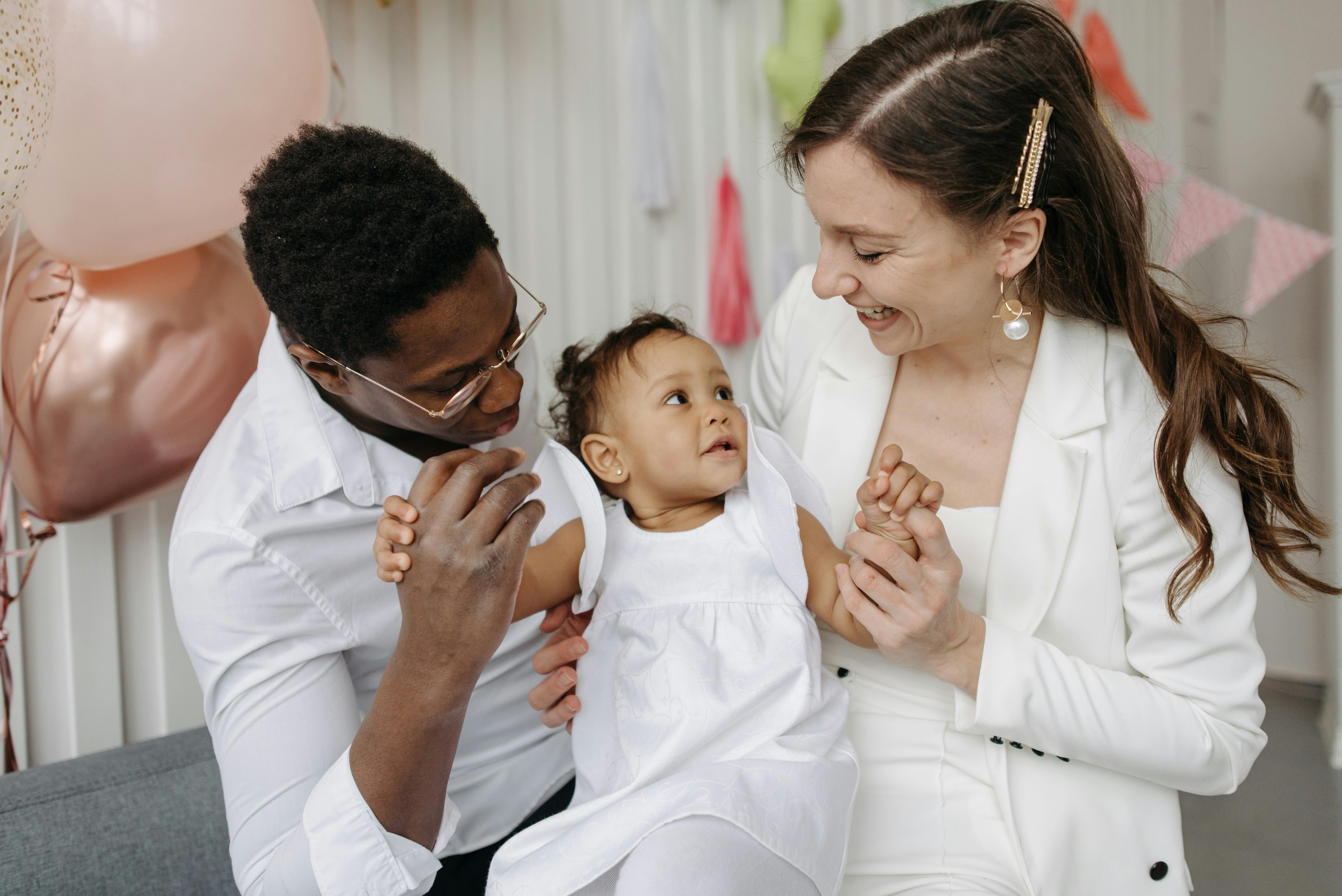 A Family Sitting On The Couch Free Stock Photo   Pexels Photo 7180246 