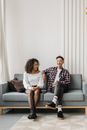 Man and Woman Sitting on Gray Couch