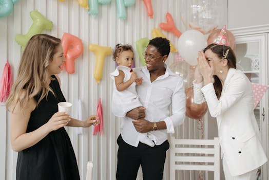 A diverse group enjoying a lively birthday party with colorful balloons and decorations.