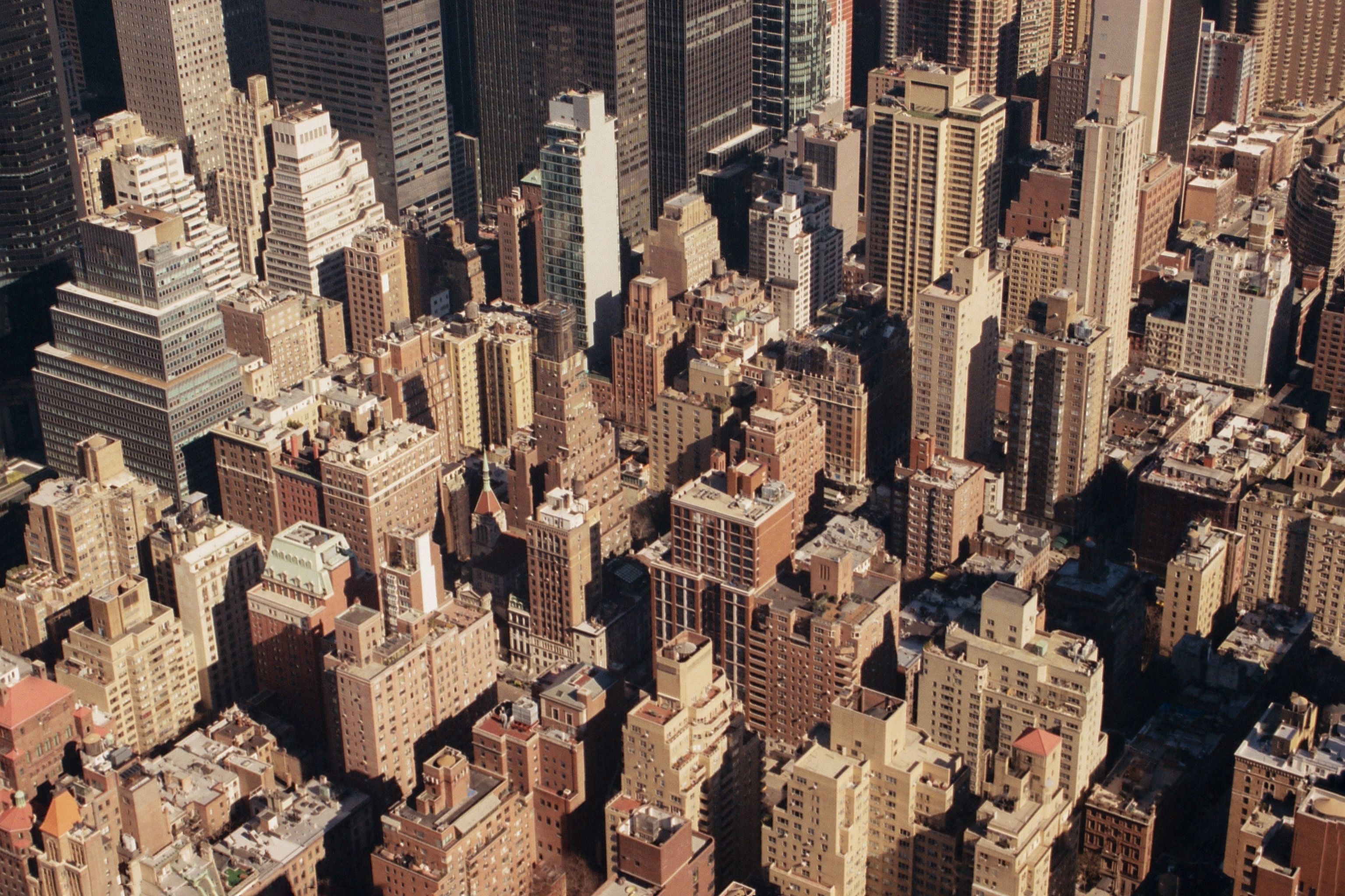 Explore the stunning aerial cityscape featuring high-rise buildings and urban architecture.