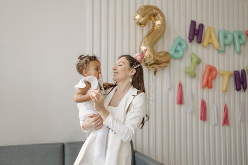 Free A Woman Carrying Her Daughter Stock Photo