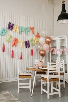 Festively decorated dining area with balloons and birthday decor for a celebration.