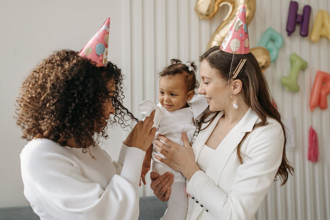 Free A joyful family birthday celebration with diverse individuals enjoying together indoors. Stock Photo Free A joyful family birthday celebration with diverse individuals enjoying together indoors. Stock Photo