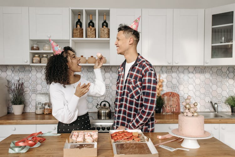 Woman In White Long Sleeve And Man In Checkered Long Sleeve Eating Dessert