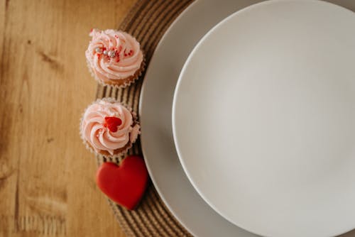 Free Close-up Shot of Ceramic Plates on a Wooden Table Stock Photo