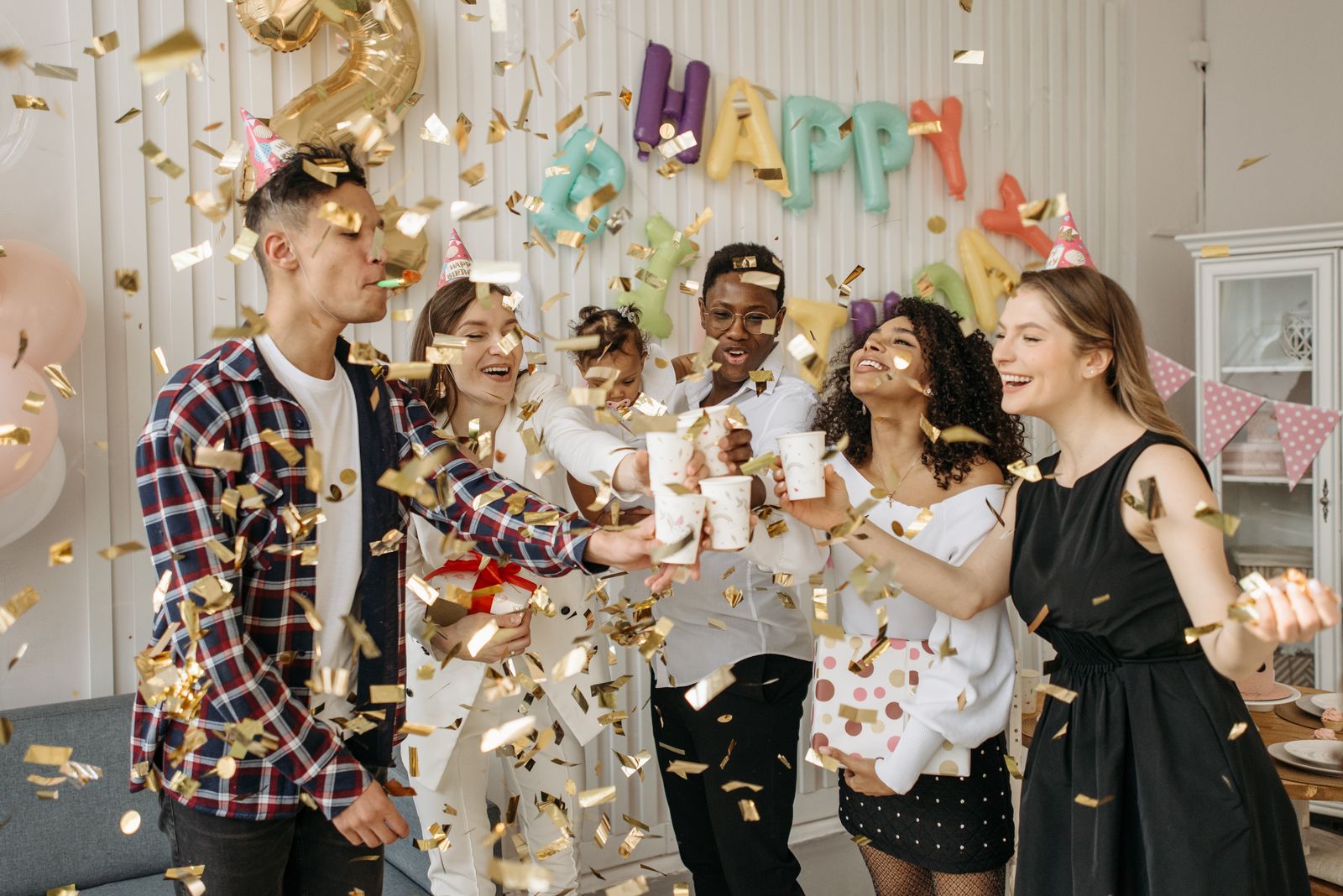 Festive baby shower celebration with pastel decorations and guests