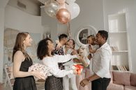 Man in White Dress Shirt Holding Baby in White Long Sleeve Shirt