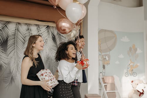Free People Singing Happy Birthday Song Holding Gifts and Balloons Stock Photo