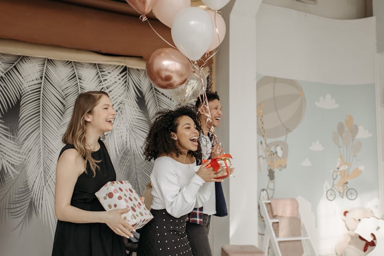 People Singing Happy Birthday Song Holding Gifts And Balloons