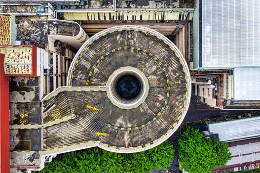 Top-down view of a spiral parking ramp in Jakarta, showcasing unique architecture.