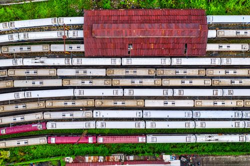 Free Drone shot capturing multiple trains at a depot in Jakarta, Indonesia. Stock Photo