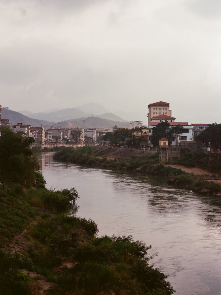 Photo Of A River Near Buildings