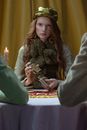 A Woman Sitting at the Table