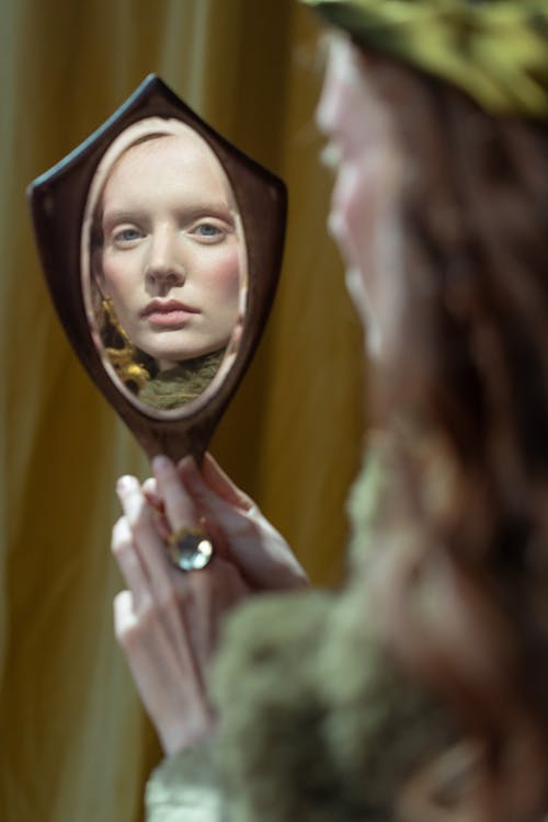 A Woman Looking at the Mirror