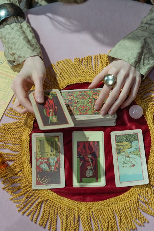 Free A Person Holding Tarot Cards Stock Photo