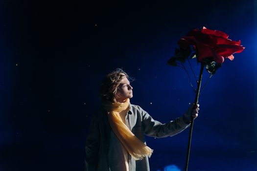Boy with Yellow Scarf Holding Big Red Rose