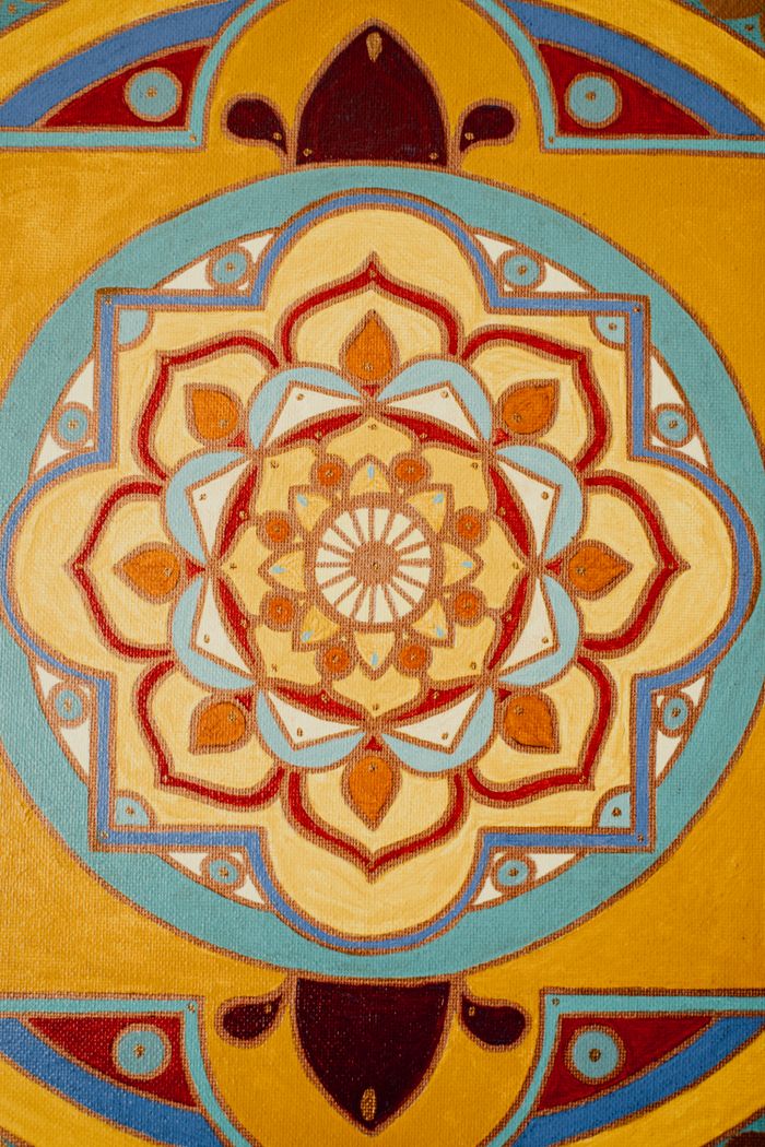 Mandala of geometric patterns in warm earthy tones — photo by Alesia Kozik on Pexels