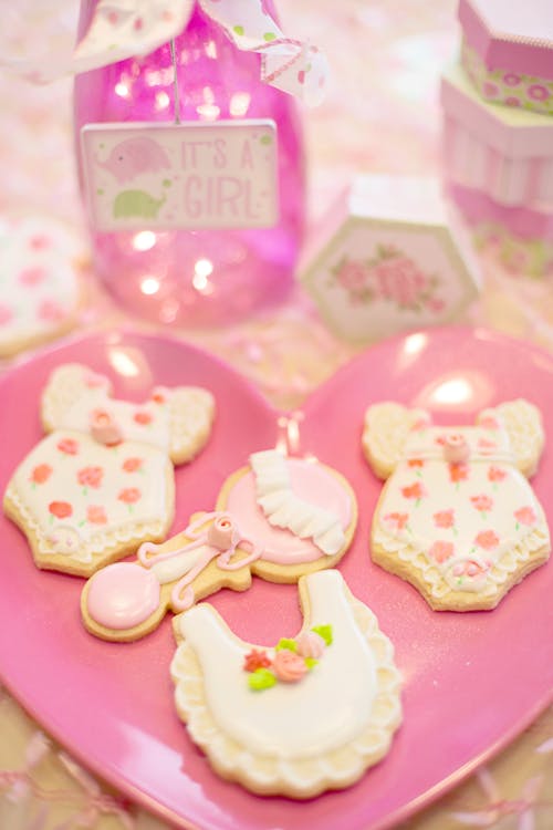 Free Beautifully decorated cookies for a baby girl shower, featuring pink and floral designs. Stock Photo