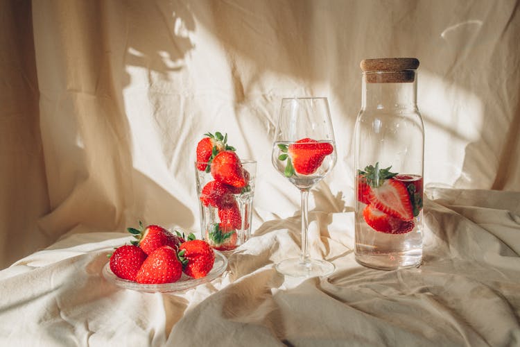 Red Strawberries In Clear Glass Jar