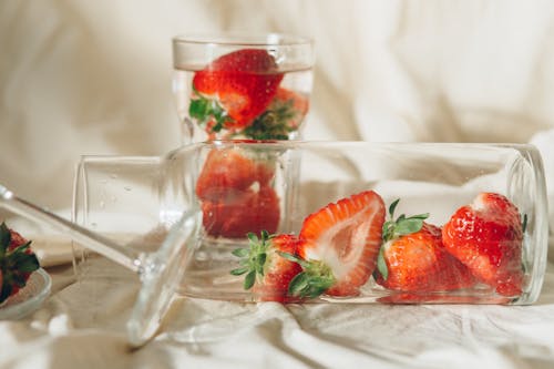 Free Close-Up Photo of Sliced Strawberries in Clear Glass Jar Stock Photo