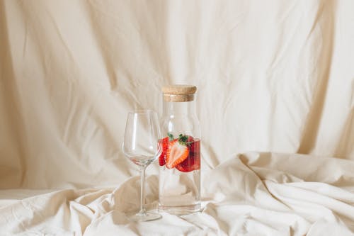 Clear Wine Glass on White Textile