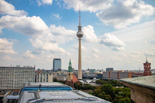 Tower Under Blue Sky and White Clouds in the City Area