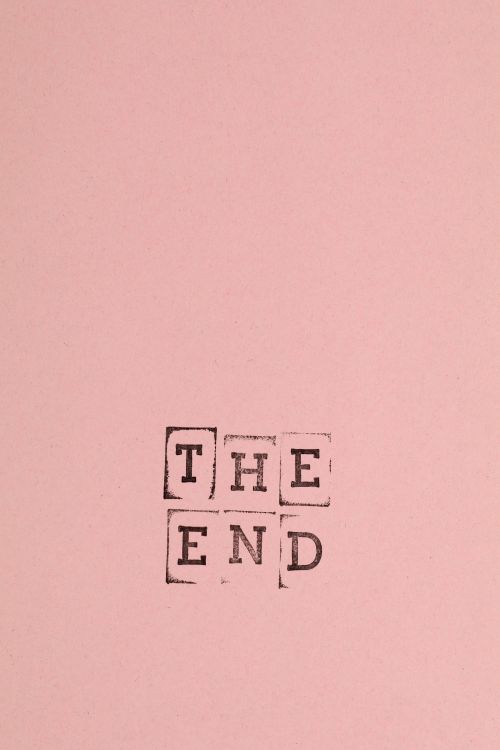 Free A simple pink background featuring the stamped words 'The End'. Stock Photo