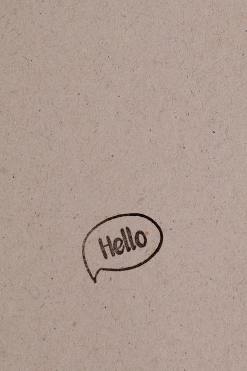 A Hello Text on Brown Surface