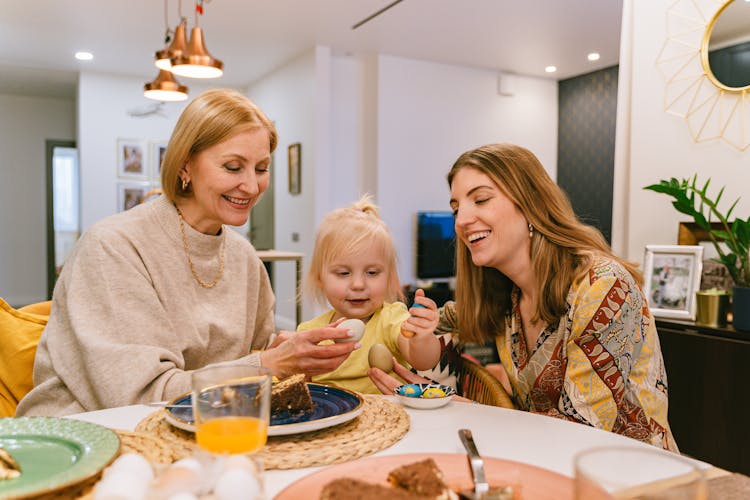 Happy Family Holding Easter Eggs