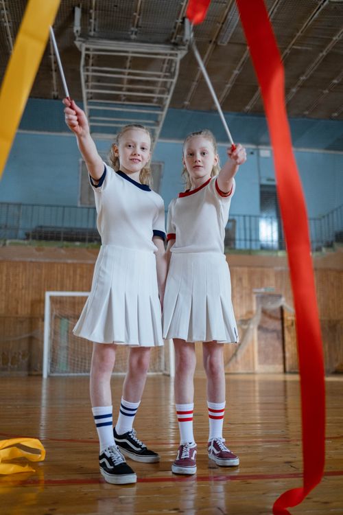 Girls practising a dance routine with ribbons