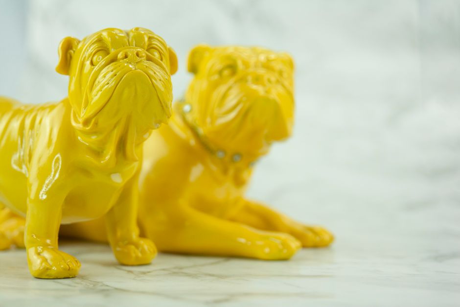 custom Row of colorful cat figurines with orange one in front for pet memorial display