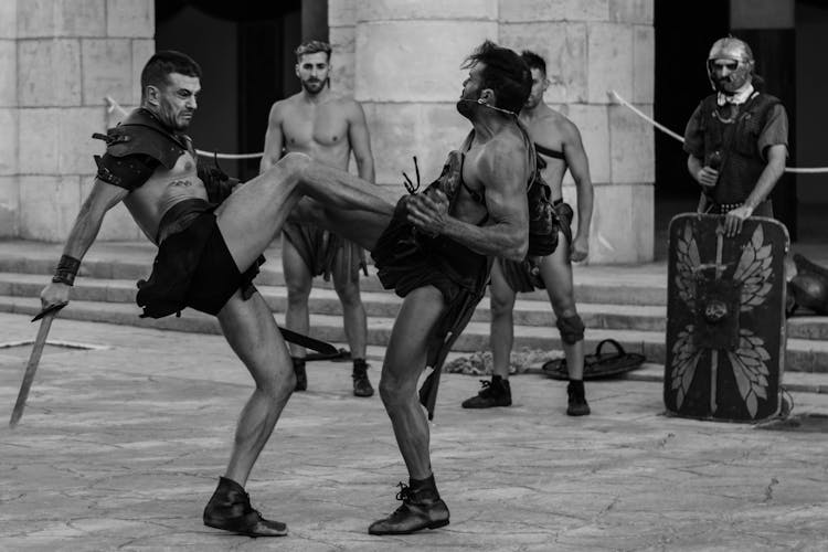 Men In Costumes Fighting On Street