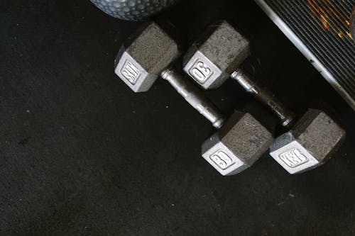 Close-Up Photo of Two Heavy Dumbbells