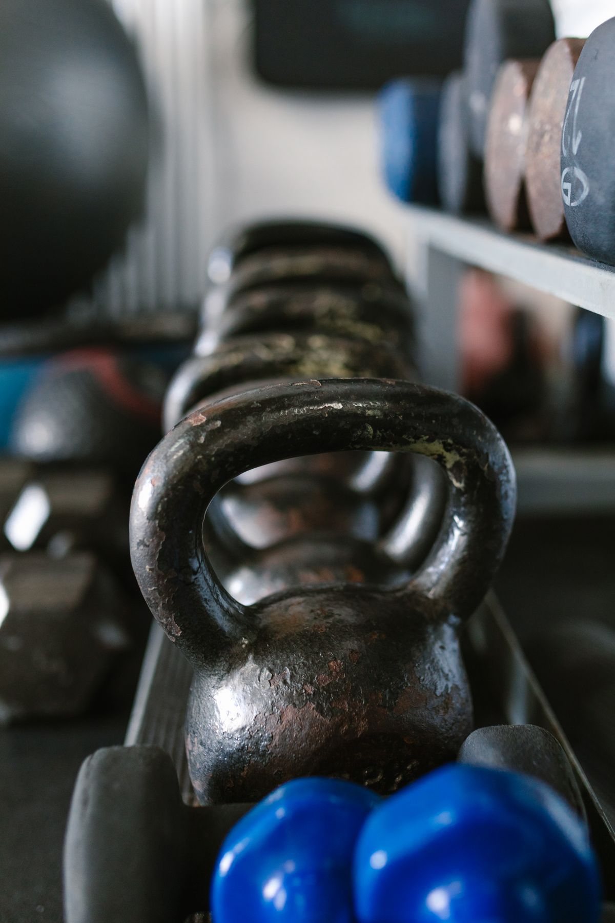 A person strength training with weights in a gym