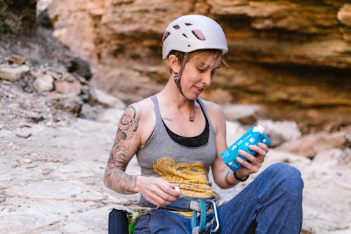 A Rock Climber Holding her Beverage